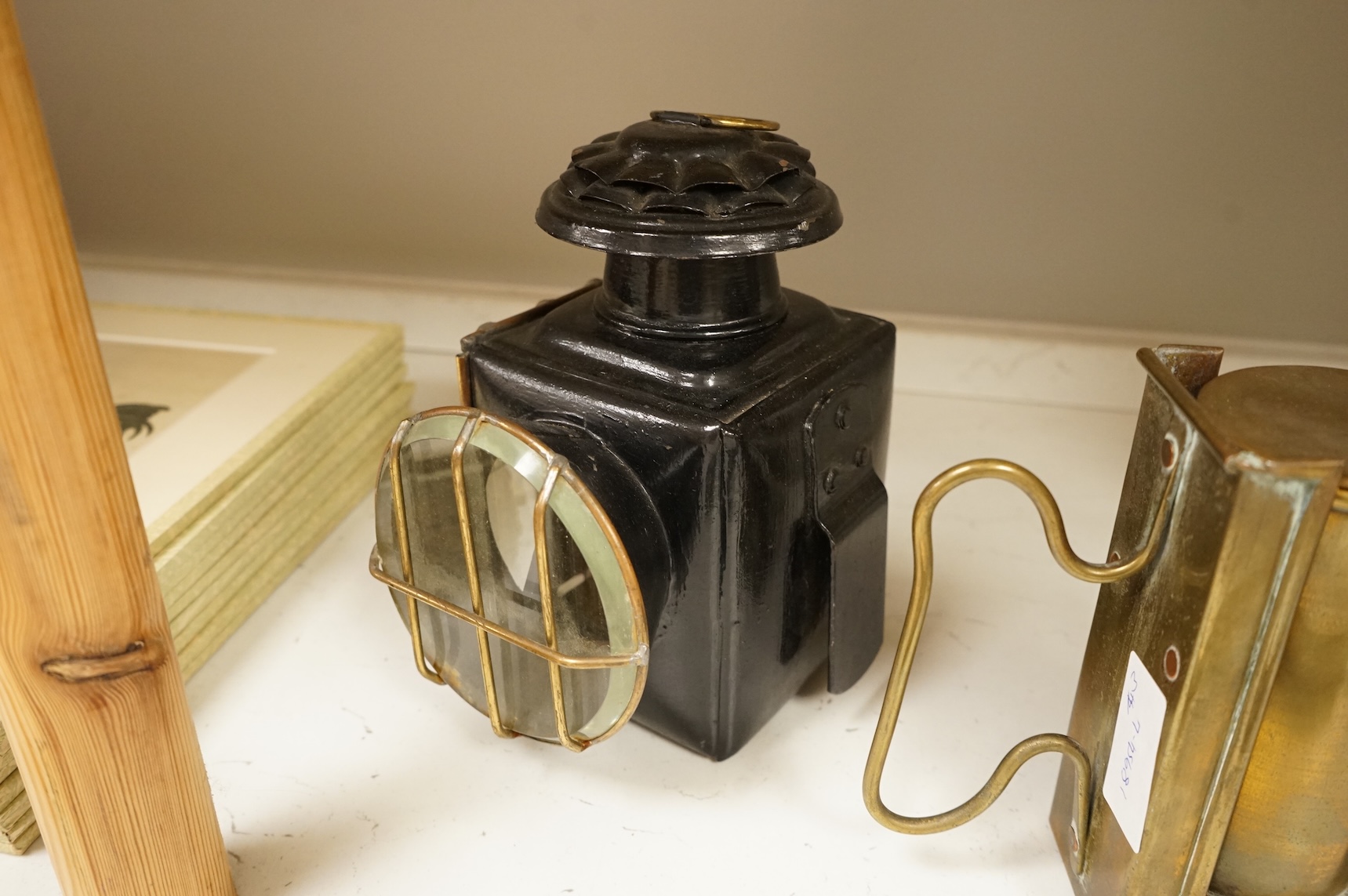 A railway lamp, a vintage Eccles Protector miners lamp and another, largest 17cm high